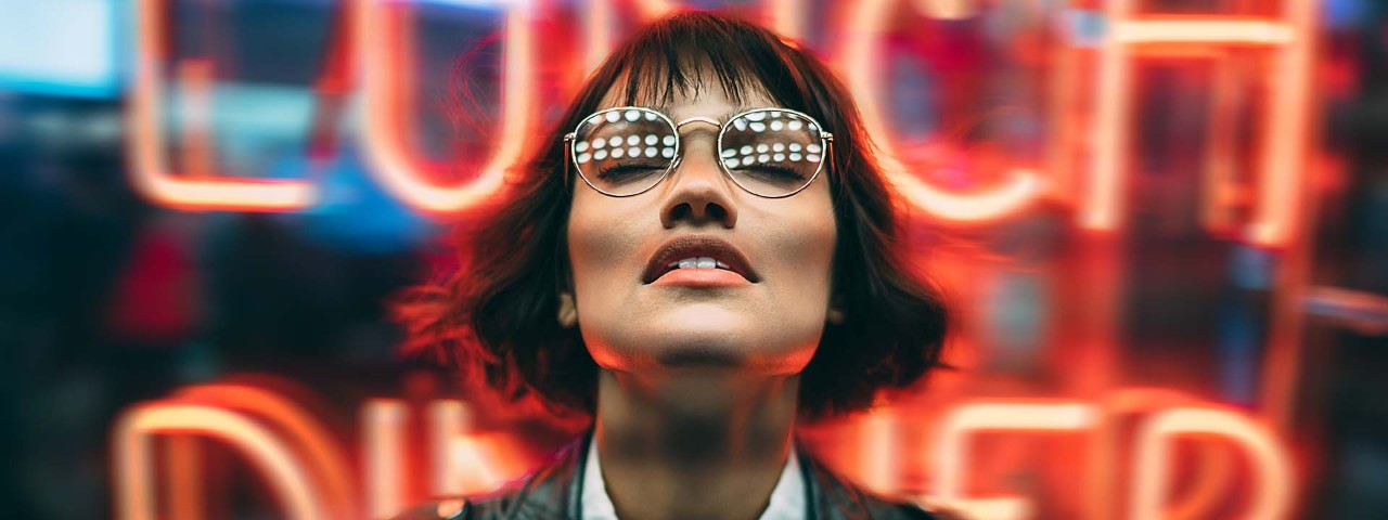 person looking up in front of an office building